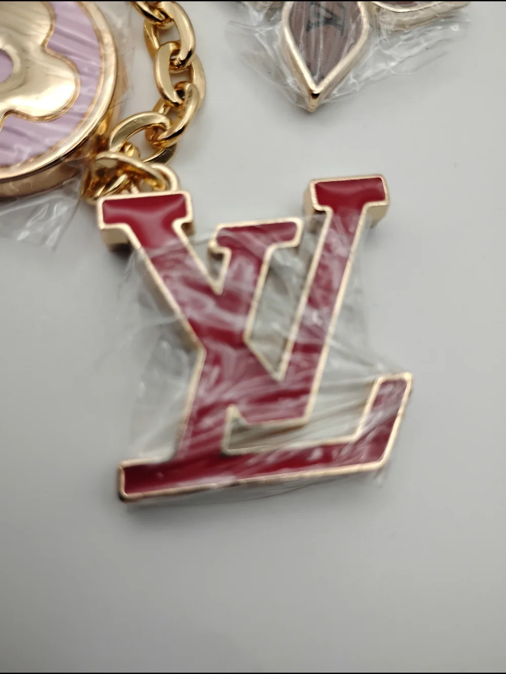 Louis Vuitton Red & Gold-Tone Keychain Charm With Pink and Brown Accents BNWOT